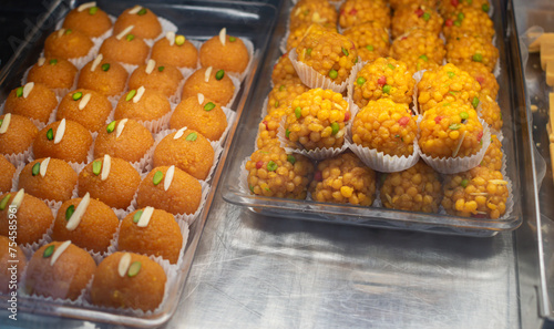 Traditional Indian sweets and desserts in pastry shop and street food on markets photo