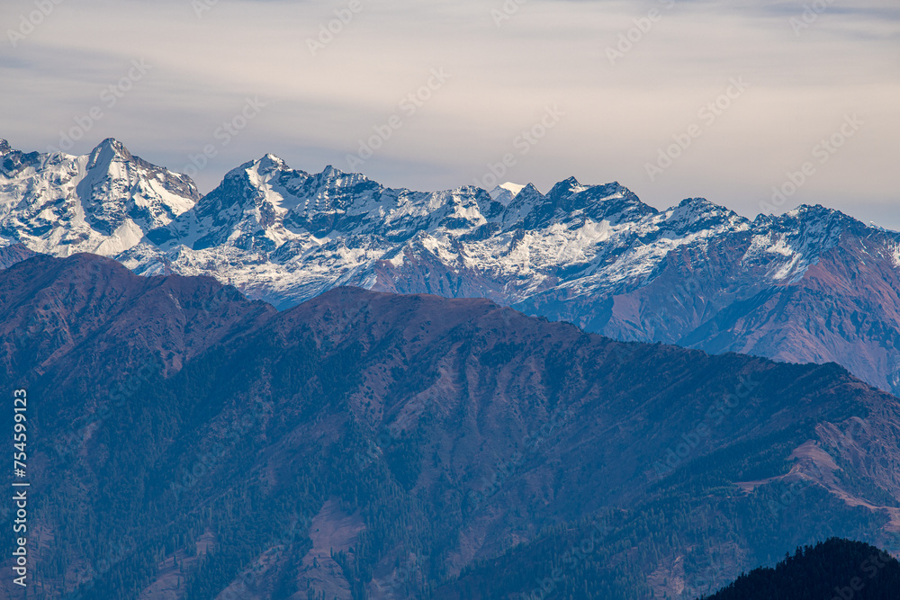 Stark Contrasts: Snow-Capped Ridges Overlooking Murma Top, Nepal