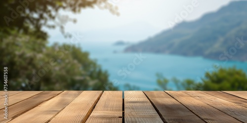 Wooden tabletop with a blurred natural landscape of hills and a lake in the background, capturing the essence of a serene retreat.