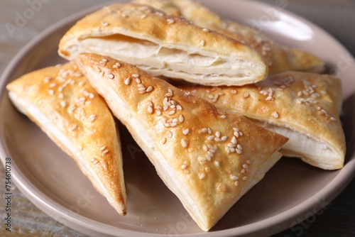 Delicious fresh puff pastries on table, closeup