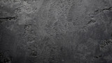 Black stone background with copy space for header design. Texture of concrete wall surface