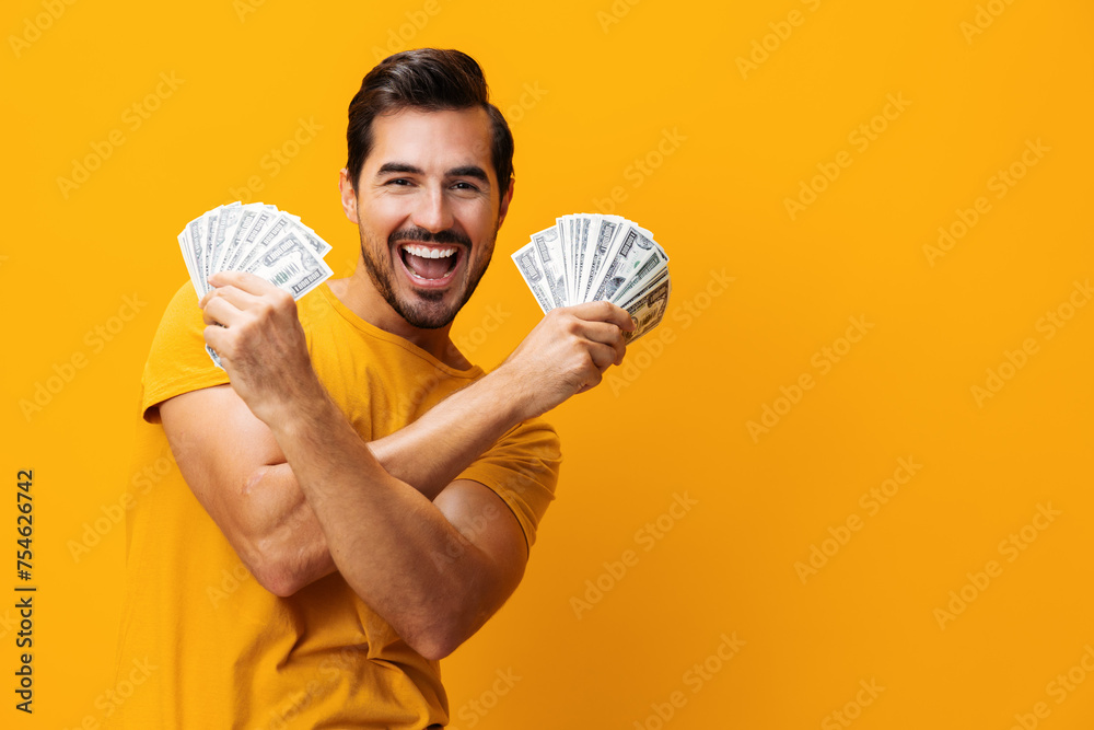 Man money surprised hand currency dollar happy rich background yellow success finance business smiling cash - obrazy, fototapety, plakaty 