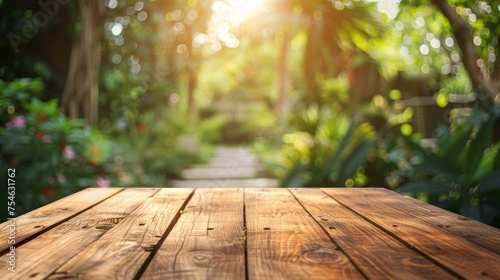 Wooden table top with copy space. Garden background