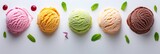 Colorful ice cream scoops with sauce drips and mint leaves