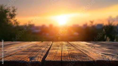 Wooden table top with copy space. Sunrise background