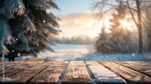 Wooden table top with copy space. Snowy landscape background © Jane Kelly