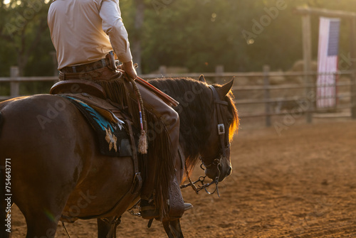 Cowboy Horse Trainer in the golden hour morning haze