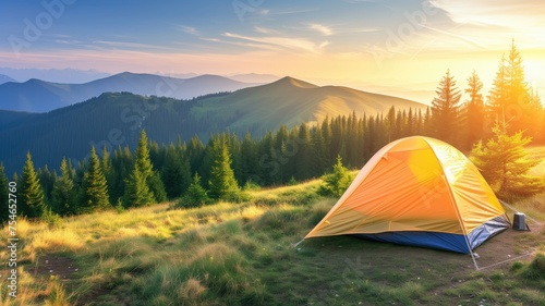 Tent on a hill at sunset with panoramic mountain views