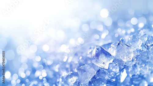 Sparkling ice cubes on a vibrant blue backdrop with bokeh