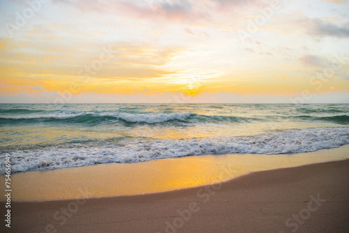Sunrise horizon, soft sky, turquoise sea waves