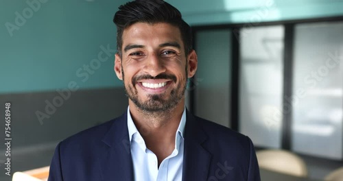 Head shot portrait of mature 40s bearded Indian self-assured businessman, company boss, executive manager or CEO posing at workplace smile, looking at camera. Career, professionalism, business advance photo