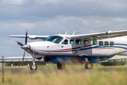 Cessna light aircraft taxiing at an airport