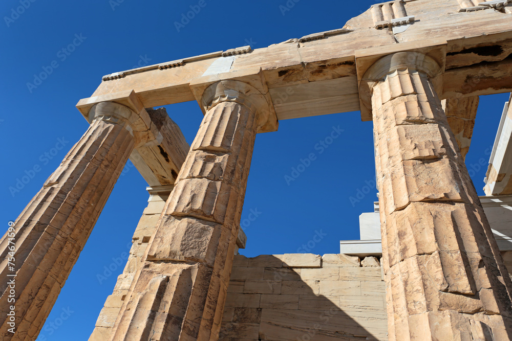Up view to The Propylaea columns, the monumental gateway that serves as the entrance to the Acropolis.