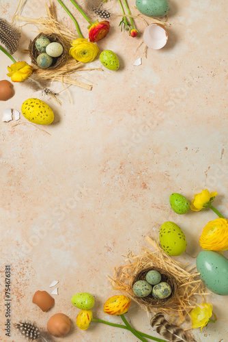 Easter holiday vertical border frame background with easter eggs and spring flowers. Top view, flat lay composition