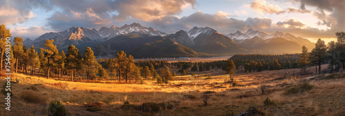 A panorama view mountains at sunrise, with golden rays illuminating peaks and a forest, Mountain landscape at sunset, nature banner background