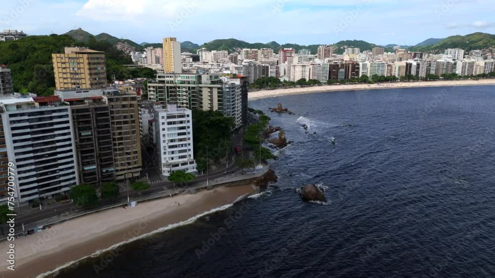 Aerial shot drone flies past Flechas beach toward Icaraí beach in Niterói