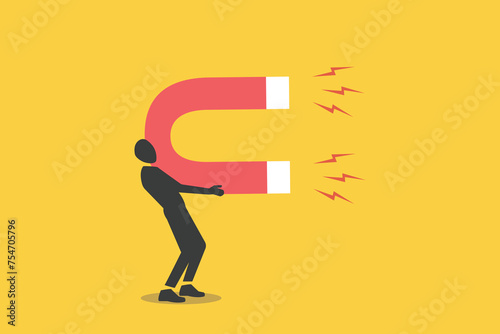 Businessman with giant magnet. concept of target investments, attracting money, lead generation