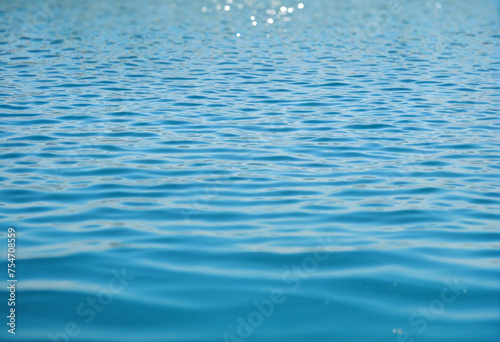 Quiet water surface with sparkling light