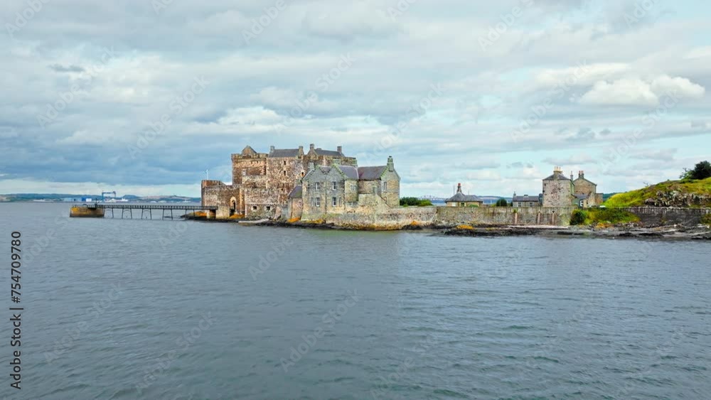 Aerial view of Blackness Castle, shiplike form fortress in Blackness, Scotland. Castle with rampart views stands on a rocky spit in the Firth of Forth, Scotland. Aerial view of Blackness Castle, shiplike form fortress in Blackness, Scotland. Castle with rampart views stands on a rocky spit in the Firth of Forth, Scotland.