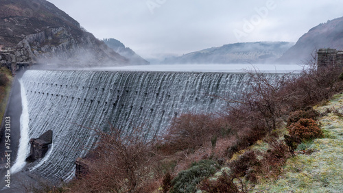 Caban Coch waterfall early morning with mist rising. One of the waterfalls in the elan valley, Radnorshire, Mid wales.