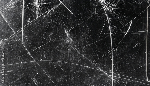 White scratches and dust on black background. Vintage scratched grunge plastic broken screen texture. Scratched glass surface wallpaper. Space for text.