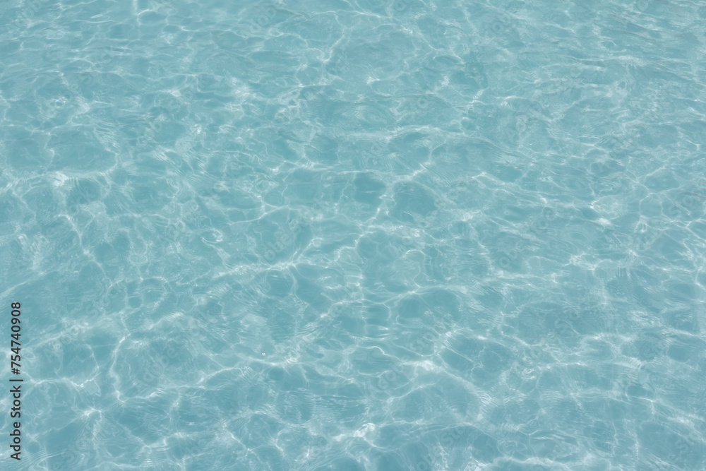 The light reflects blue in the water in the swimming pool. It looks fresh and lively, suitable for use as a wallpaper. The light reflects blue in the water in the swimming pool. It looks fresh and lively, suitable for use as a wallpaper.