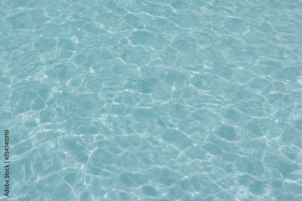 The light reflects blue in the water in the swimming pool. It looks fresh and lively, suitable for use as a wallpaper.