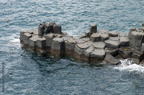 View of the columnar jointings at the seaside of Jeju Island photo