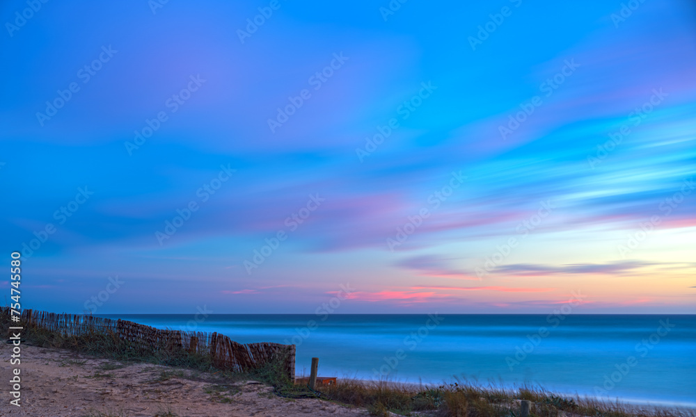 Abstract Beach Sunset with Pink and Blue Clouds, Silky Water and Cottony Sky