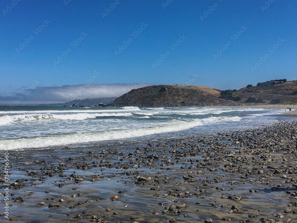 Breathtaking rugged rocky coast nature landscape scenery panoramic California coastal view at Highway 1 One enroute to Capitola, CA with lush vegetation and flowers and Pacific Ocean spray