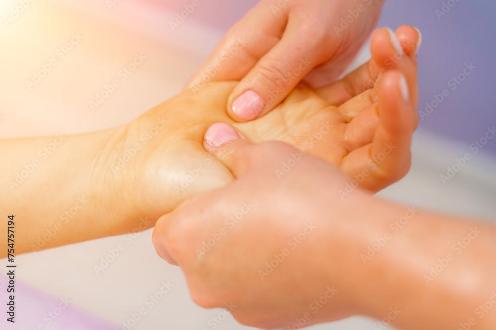 Facial massage. A woman is given a massage in a beauty salon. Close-up. Facial massage. A woman is given a massage in a beauty salon. Close-up.