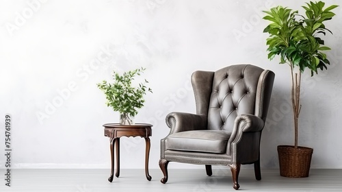 An antique armchair, complemented by a houseplant, graces a white wall, illustrating interior design concepts. photo