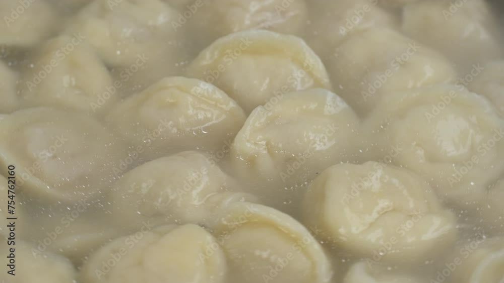 Zoom frame cooking meat dumplings in boiling water