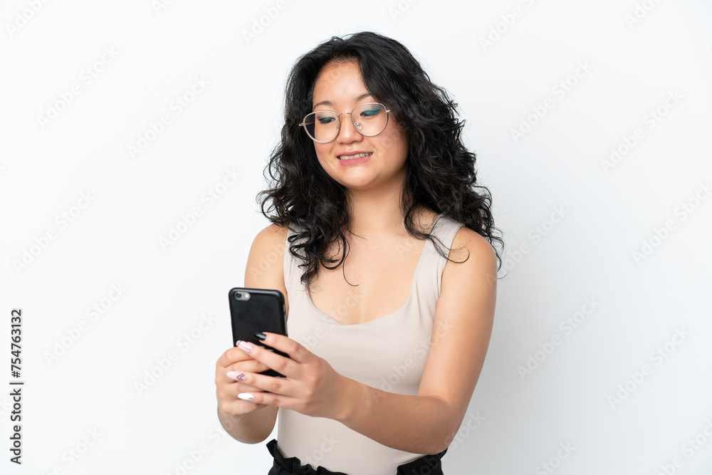 Young asian woman isolated on white background sending a message or email with the mobile Young asian woman isolated on white background sending a message or email with the mobile