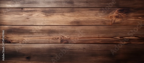 A detailed view of a wooden surface with visible knots and textured grains. The knots add visual interest to the otherwise smooth wood.