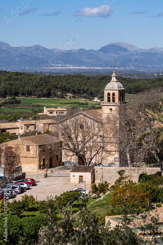 town of Randa  parish church of the Immaculate Conception and Ramon Llull with the Tramuntana mountain range in the background  Algaida  Mallorca  spain