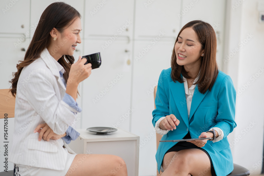 Fototapeta premium Asian business woman working and talking at the office 