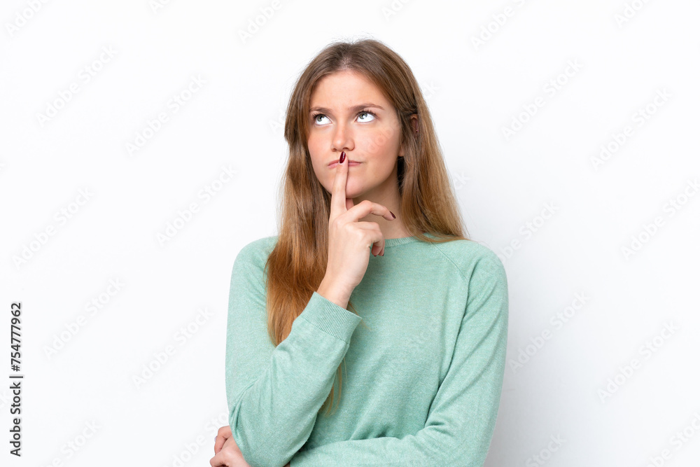 Young caucasian woman isolated on white background having doubts while looking up Young caucasian woman isolated on white background having doubts while looking up