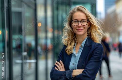 Woman With Glasses Standing in Front of Building