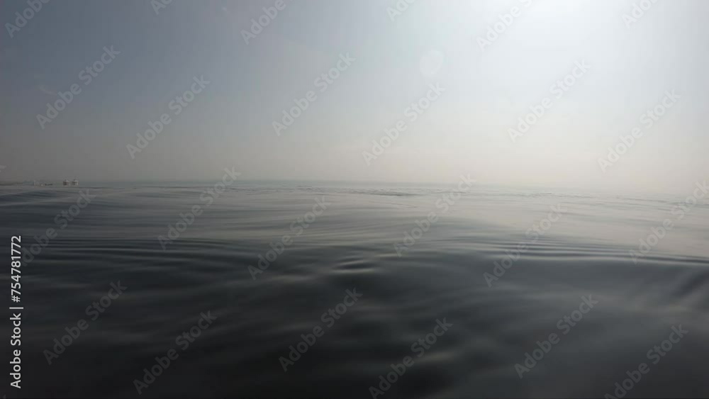 water wave surface of outdoor swimming pool in summertime, motion scene with cloud in the sky water wave surface of outdoor swimming pool in summertime, motion scene with cloud in the sky