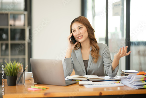 Asian businesswoman holding notebook about business  spending 