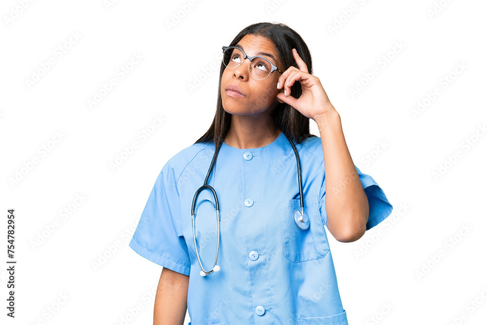Young African american nurse woman over isolated background having doubts and with confuse face expression Young African american nurse woman over isolated background having doubts and with confuse face expression