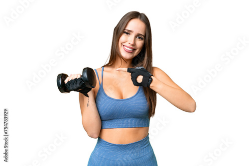 Young sport woman making weightlifting over isolated chroma key background and pointing it