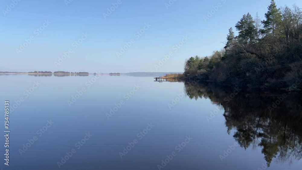 Morning on the river bank, calm blue water, autumn weather on the Dnipro River. Fresh water river. Ukrainian reservoir Dnipro, reservoir, fishing. High quality 4k footage Morning on the river bank, calm blue water, autumn weather on the Dnipro River. Fresh water river. Ukrainian reservoir Dnipro, reservoir, fishing. High quality 4k footage