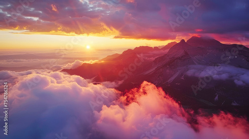 An aerial view of a spectacular sunset over the mountains, with spectacular clouds © Adrian Grosu