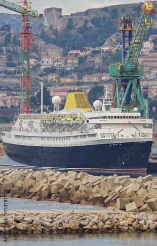 Classic historic ocean liner cruiseship cruise ship in wet dry dock for maintenance refurb modernisation in Marseille Provence, France photo