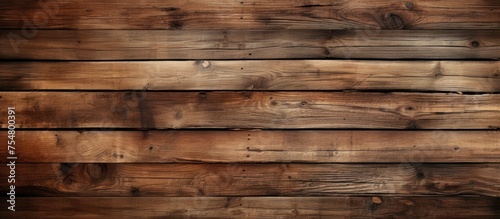 A detailed view of a wooden plank wall, showcasing the natural grains and textures of the wood. The wall appears weathered, with distinct patterns and knots adding depth to the surface.