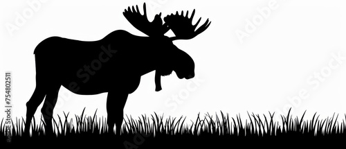  a black and white silhouette of a moose with antlers on it's back, standing in tall grass.