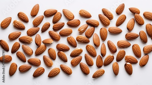 Numerous almond seeds are isolated on a white background, providing a top view angle and a clipping path for easy extraction.