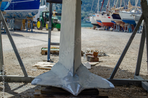 Wing keel of the sailing yacht. Boat repair in dry dock